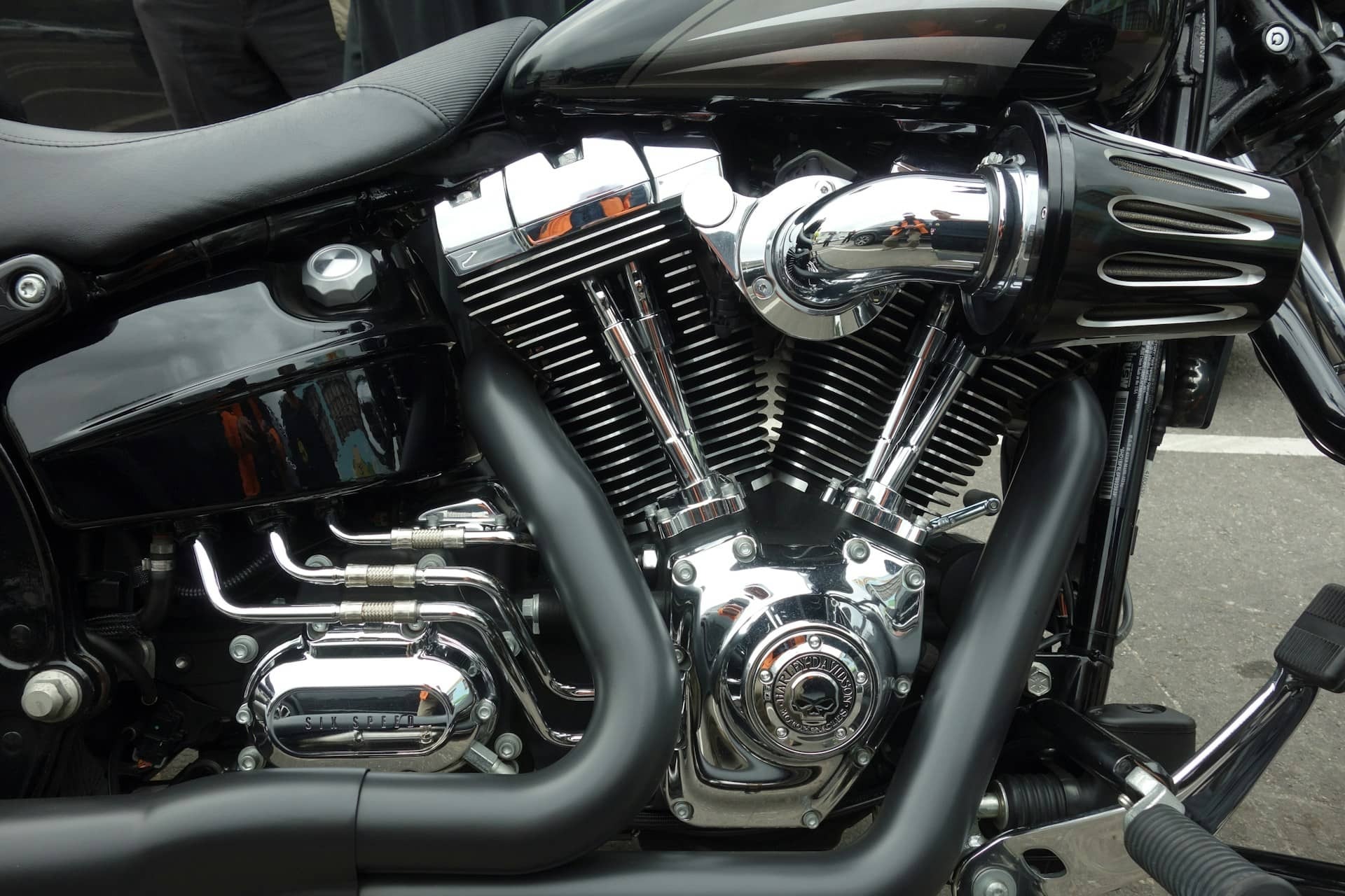 Motorcycle engine with custom black exhaust pipes