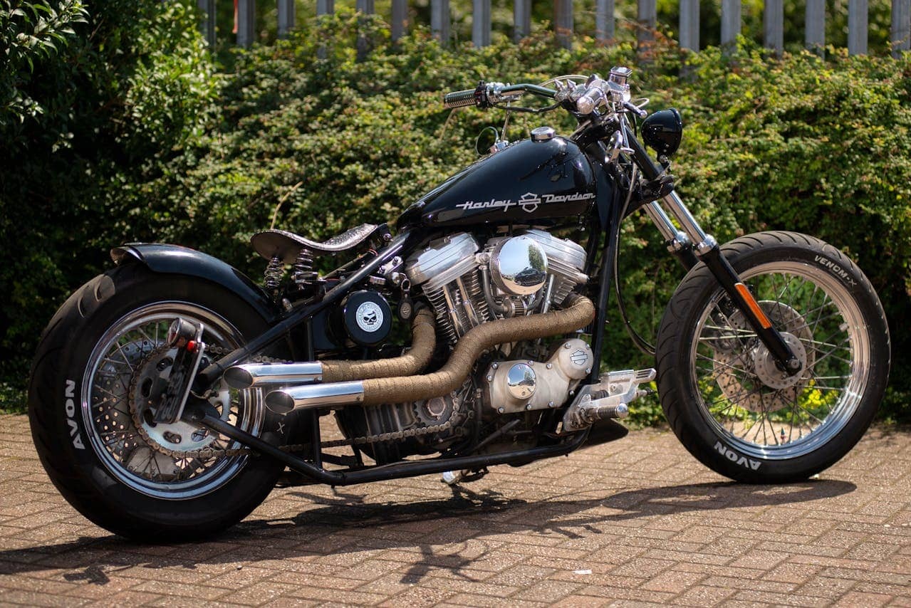 A Harley-Davidson motorcycle with wrapped exhaust pipes