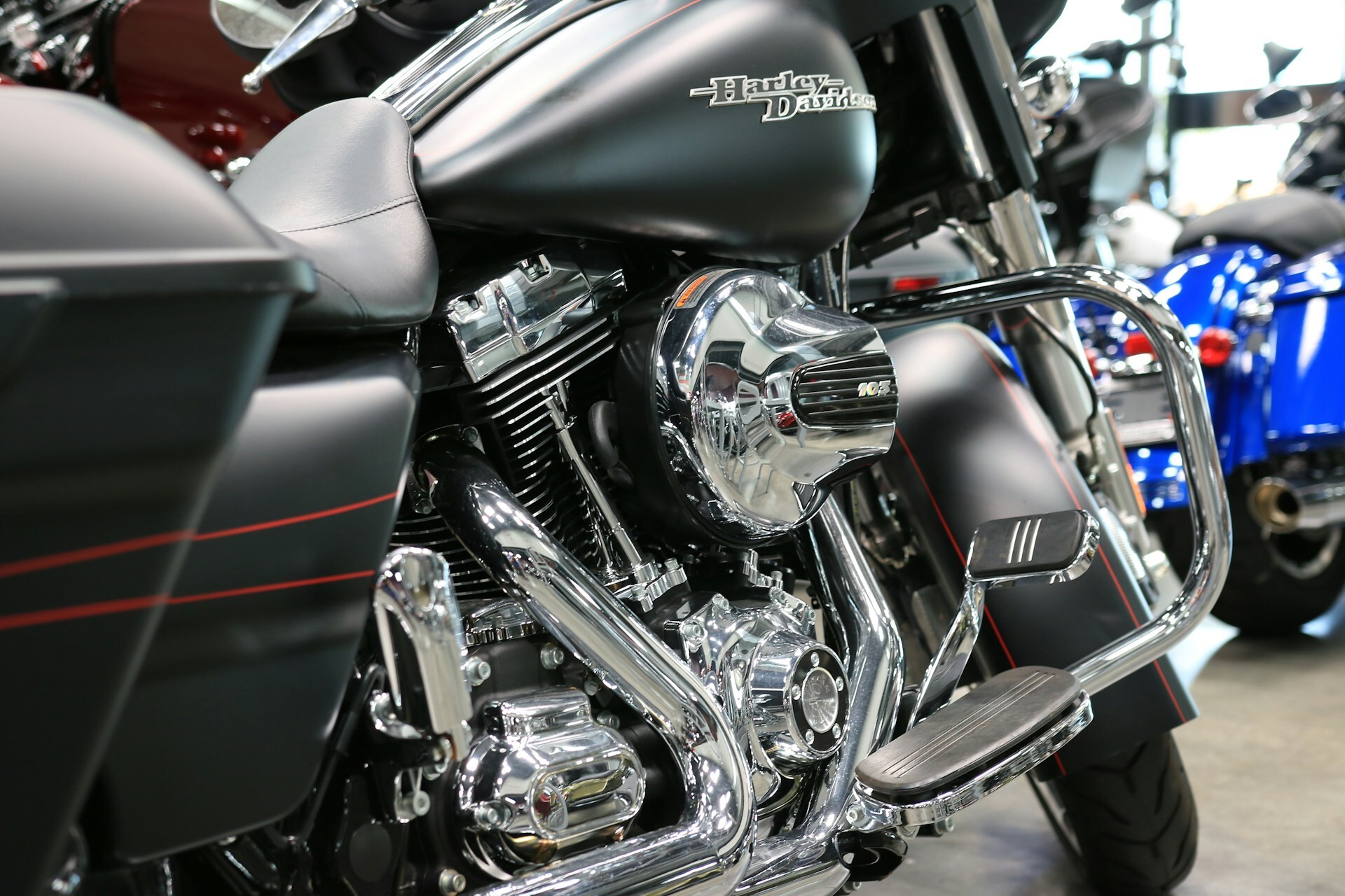 A close-up of a Harley Davidson motorcycle with polished chrome engine parts