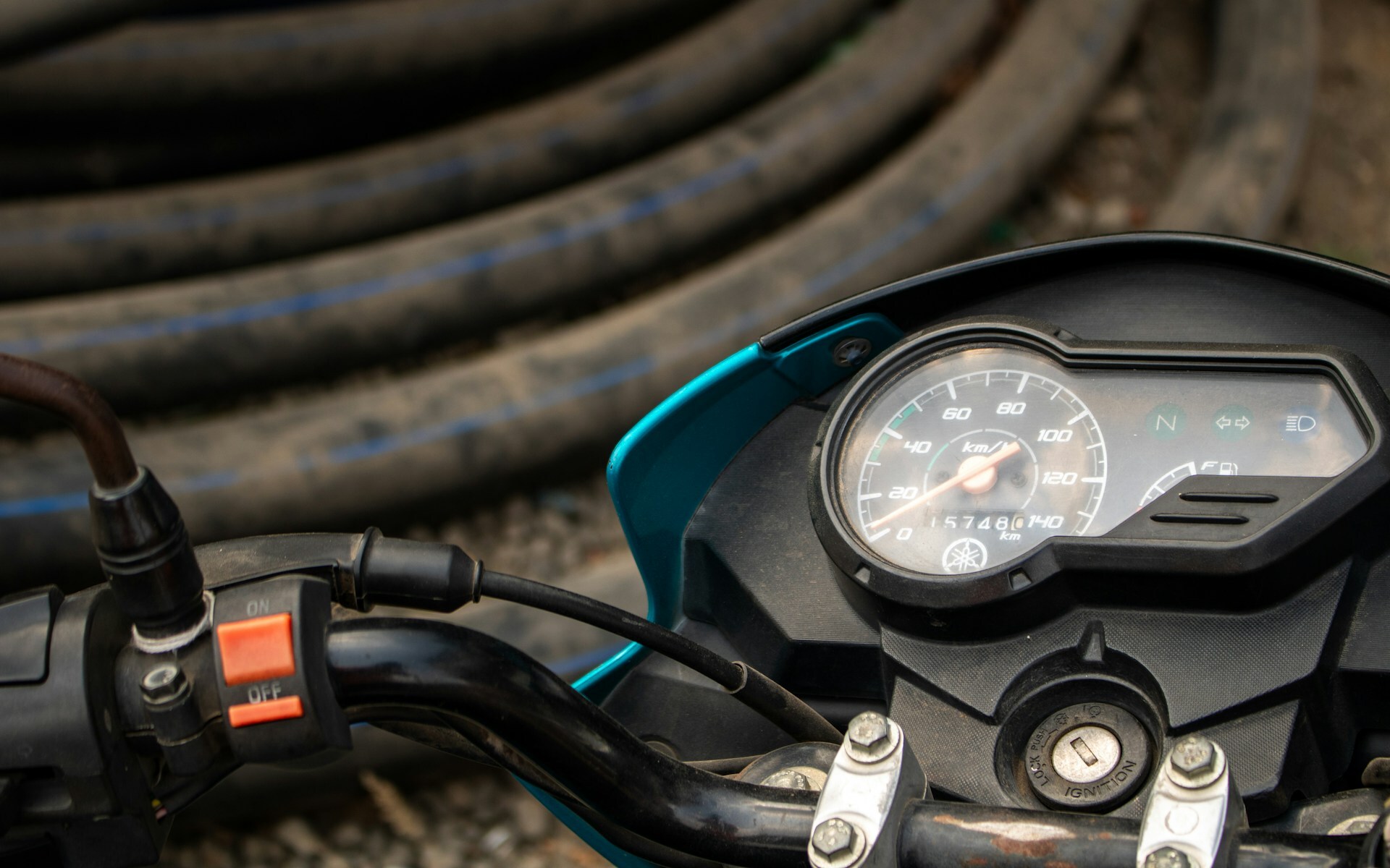Close-up of a motorcycle handlebar and throttle grip
